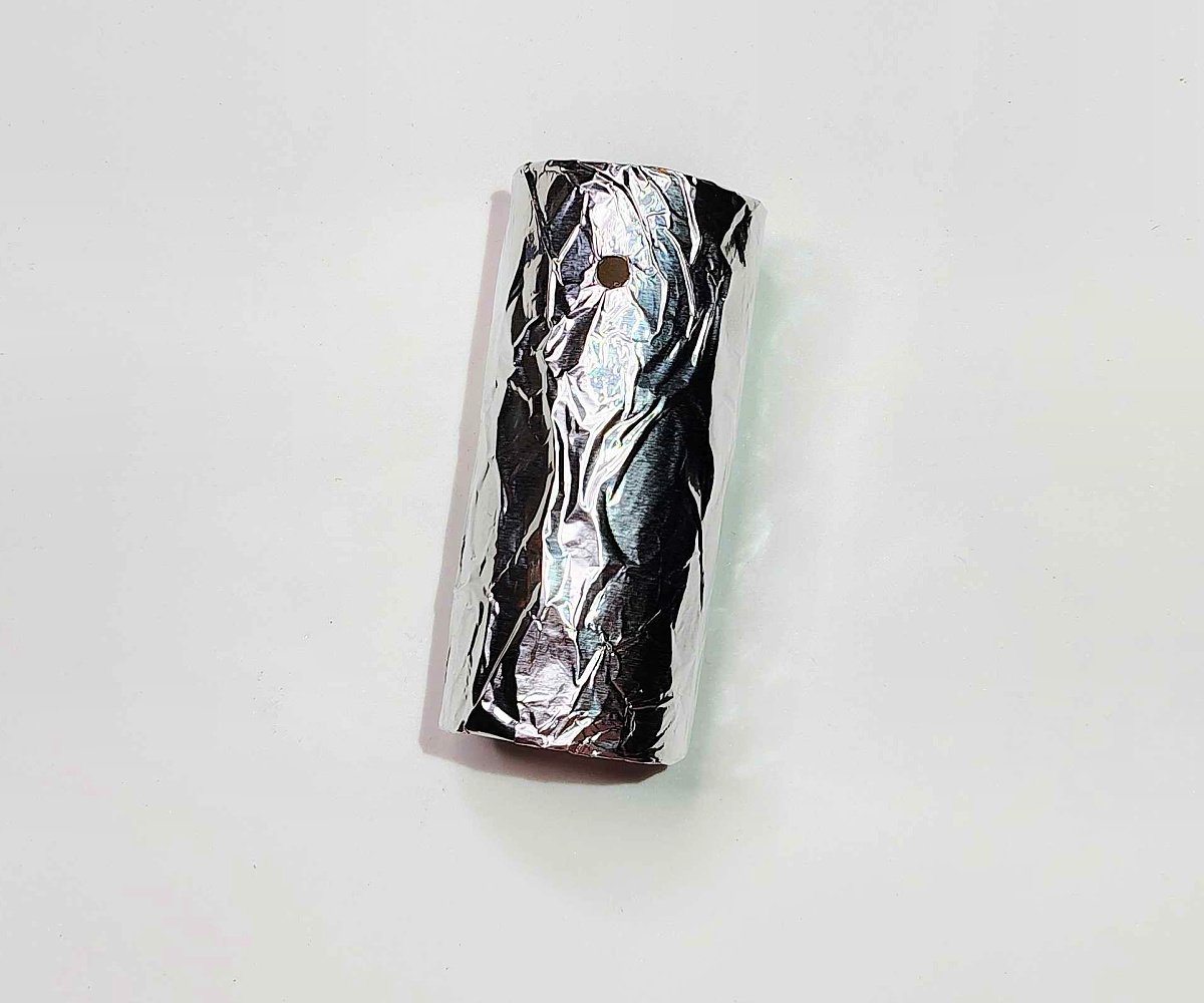 Toilet Paper Roll Craft- Step 3- Wrap the toilet paper roll in aluminum foil- Kids Activities Blog