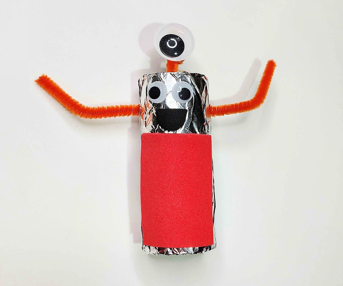 Toilet Paper Roll Craft- Step 6 - Googly eyes added to toilet paper roll- Kids Activities Blog