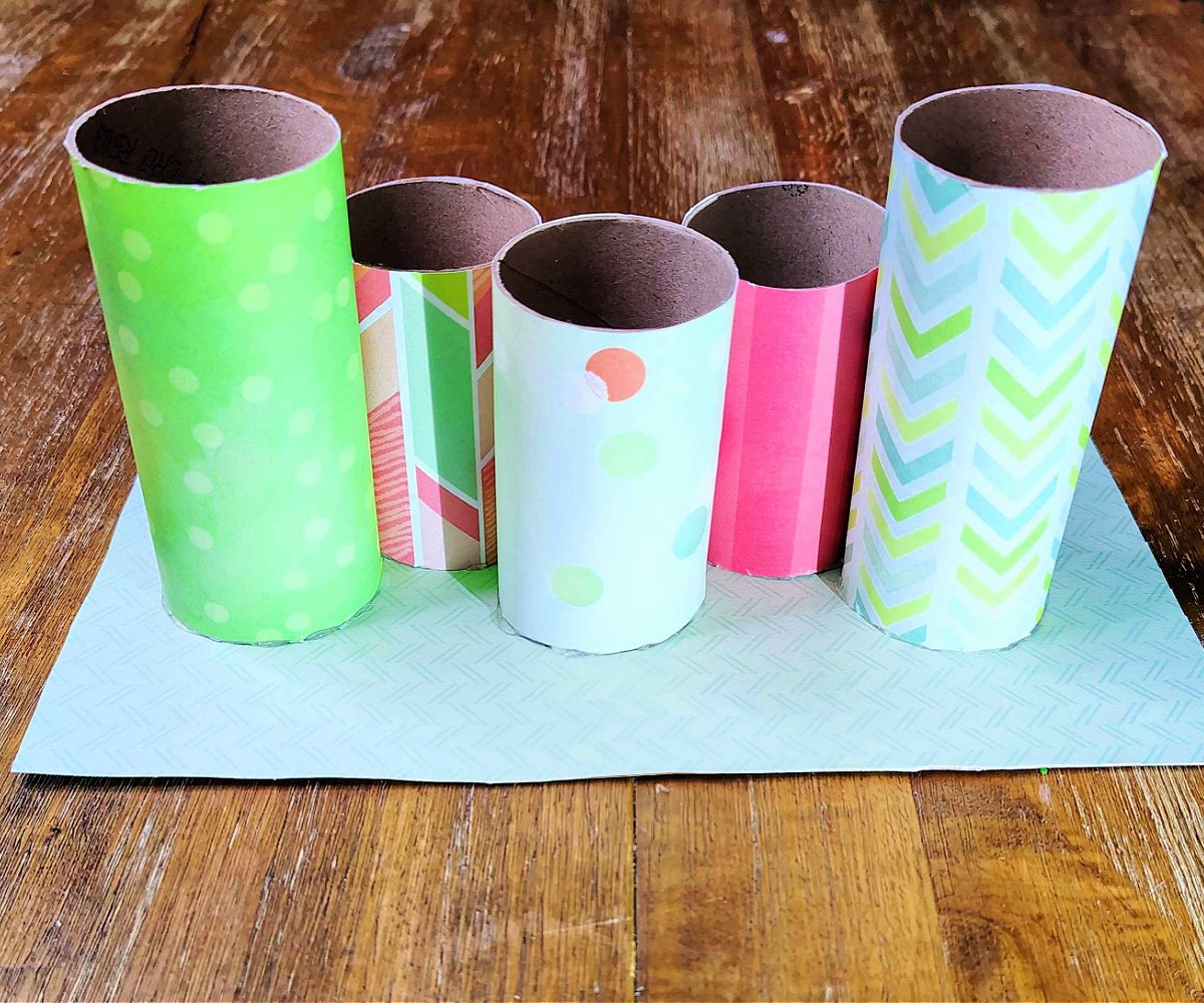 Toilet Paper Roll Craft- Step 4 - Hot glue tubes to cardboard- Kids Activities Blog