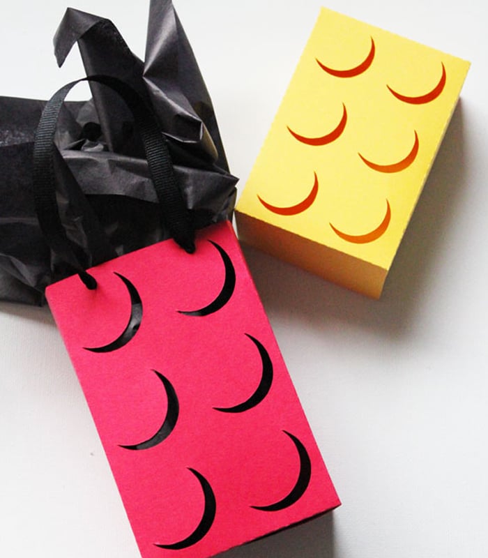 Construction paper craft ideas: make lego bricks out of paper seen here in colors yellow and red