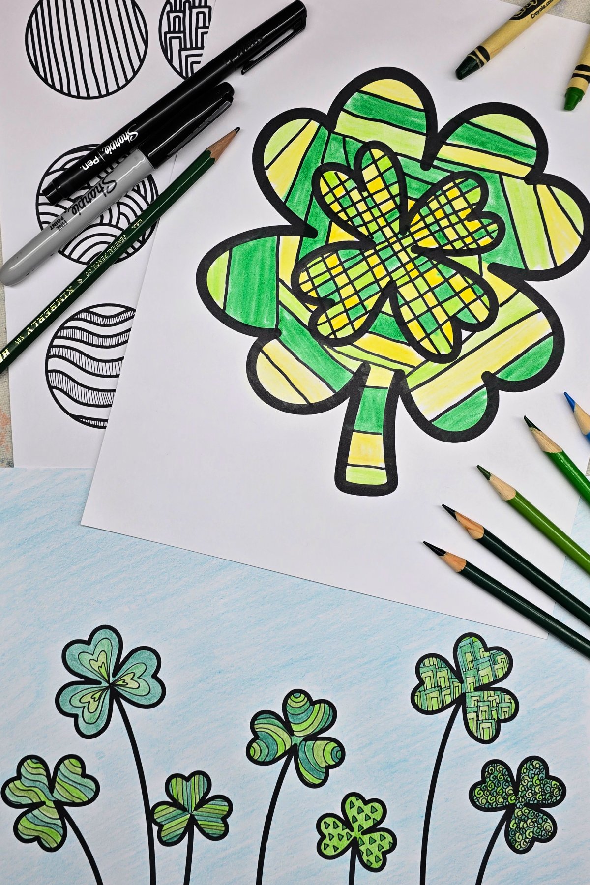 completed shamrock zentangle art projects using colored pencils, crayons, and permanent markers - kids activities blog