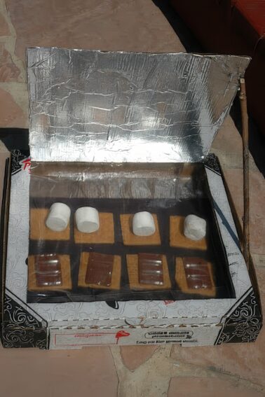 Solar S'mores being made in a pizza box