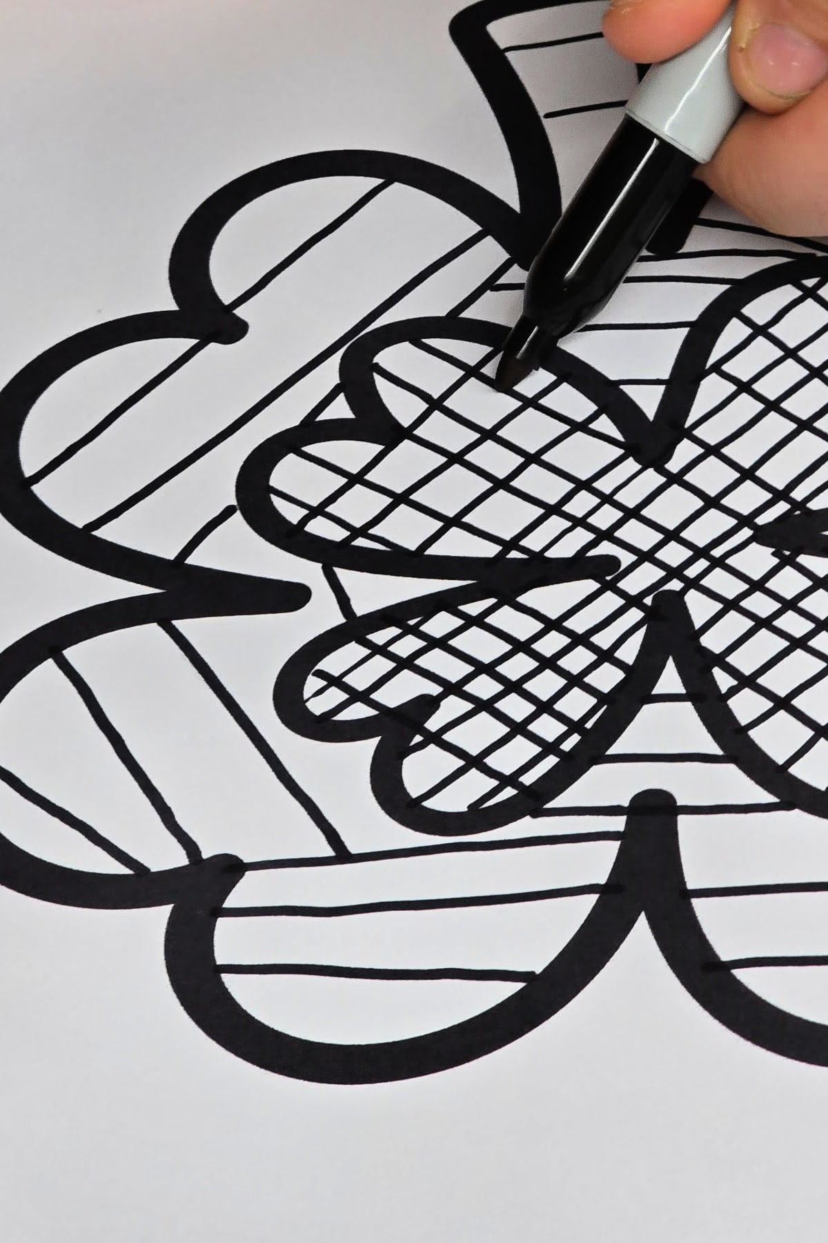 step 2 - using a permanent marker to trace pencil sketch - kids activities blog