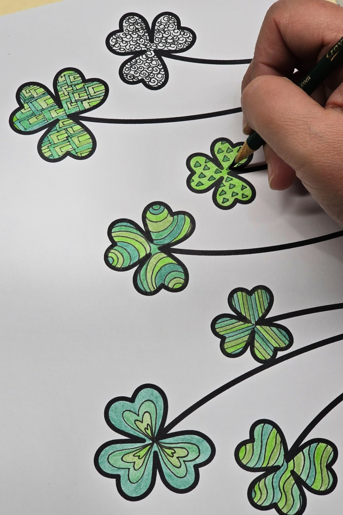 step 3 - using colored pencils to add color to our shamrock zentangle drawings - kids activities blog