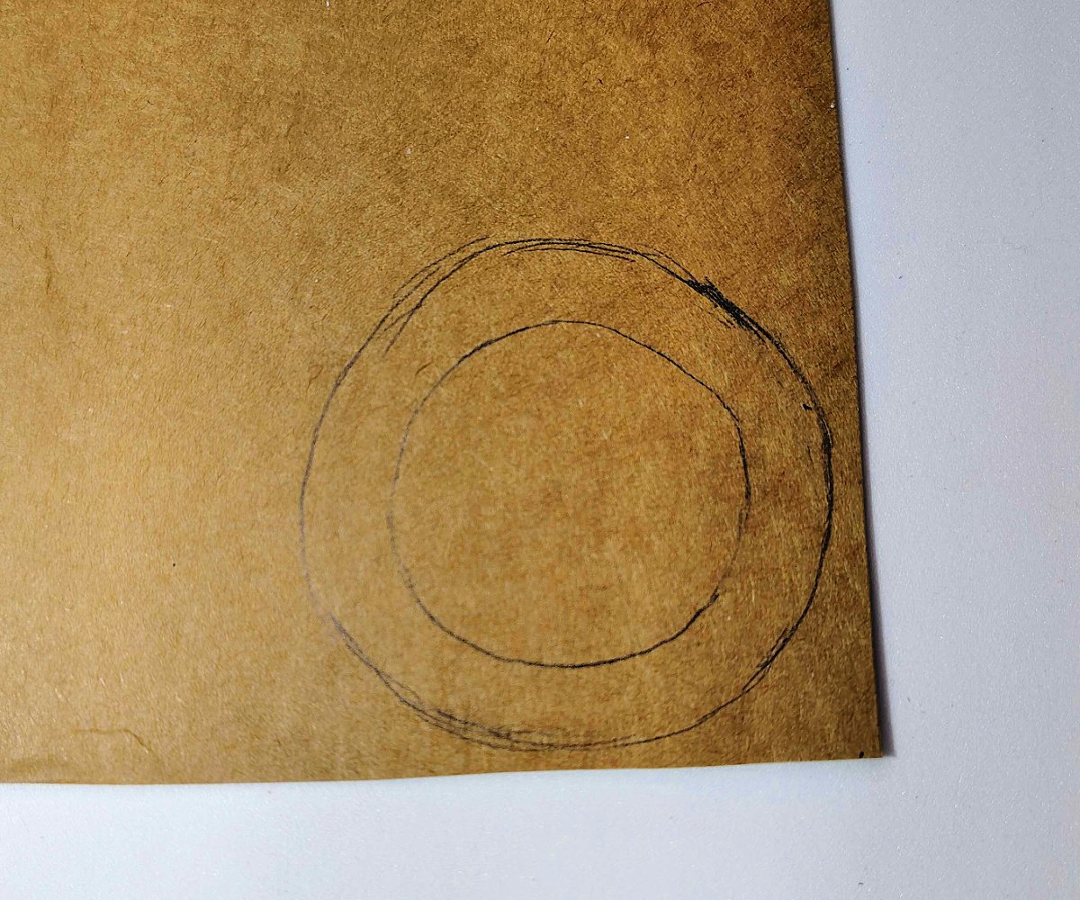 Paper Tea Cups- Step 2 - Trace toilet paper roll on cardboard and add 1/2-1/4 inch circle around it- Kids Activities Blog
